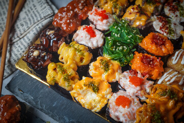 Sushi is a Japanese dish of prepared vinegared rice (鮨飯, sushi-meshi), usually with some sugar and salt, accompanied by a variety of ingredients