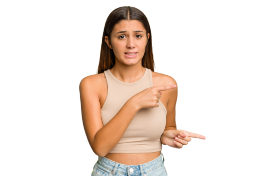 Young Indian woman isolated cutout removal background shocked pointing with index fingers to a copy space.