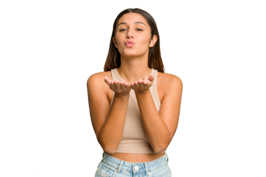Young Indian woman isolated cutout removal background folding lips and holding palms to send air kiss.