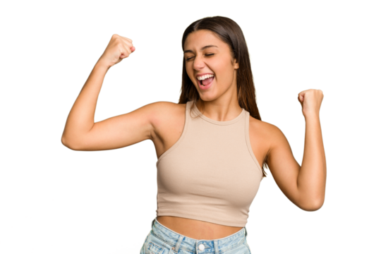 Young Indian woman isolated cutout removal background raising fist after a victory, winner concept.