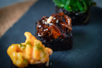 Sushi is a Japanese dish of prepared vinegared rice (鮨飯, sushi-meshi), usually with some sugar and salt, accompanied by a variety of ingredients