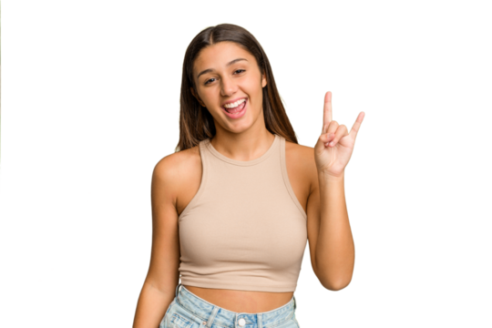 Young Indian woman isolated cutout removal background showing a horns gesture as a revolution concept.