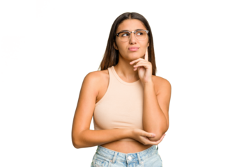 Young Indian woman isolated cutout removal background thinking and looking up, being reflective, contemplating, having a fantasy.