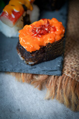 Sushi is a Japanese dish of prepared vinegared rice (鮨飯, sushi-meshi), usually with some sugar and salt, accompanied by a variety of ingredients