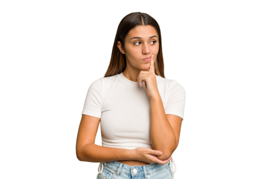 Young Indian woman isolated cutout removal background looking sideways with doubtful and skeptical expression.