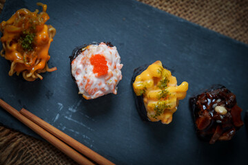 Sushi is a Japanese dish of prepared vinegared rice (鮨飯, sushi-meshi), usually with some sugar and salt, accompanied by a variety of ingredients