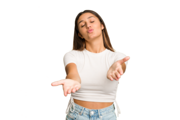 Young Indian woman isolated cutout removal background folding lips and holding palms to send air kiss.