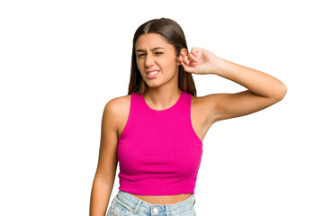 Fototapeta premium Young Indian woman isolated cutout removal background covering ears with fingers, stressed and desperate by a loudly ambient.