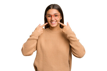 Young Indian woman isolated cutout removal background smiles, pointing fingers at mouth.