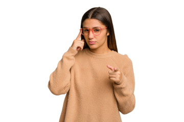 Young Indian woman isolated cutout removal background pointing temple with finger, thinking, focused on a task.