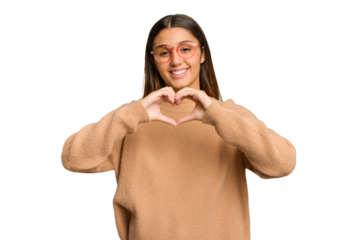 Young Indian woman isolated cutout removal background smiling and showing a heart shape with hands.
