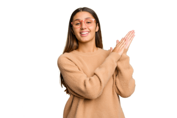 Young Indian woman isolated cutout removal background feeling energetic and comfortable, rubbing hands confident.