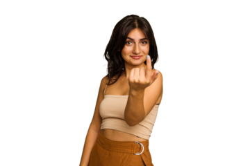 Young Indian woman isolated on green chroma background pointing with finger at you as if inviting come closer.