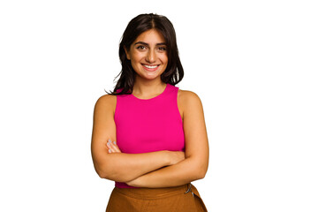 Young Indian woman isolated on green chroma background who feels confident, crossing arms with...