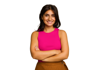 Young Indian woman isolated on green chroma background who feels confident, crossing arms with determination.