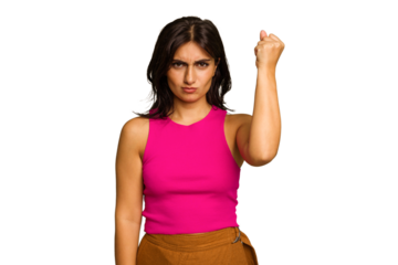 Young Indian woman isolated on green chroma background showing fist to camera, aggressive facial expression.