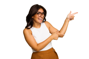 Young Indian woman isolated on green chroma background excited pointing with forefingers away.