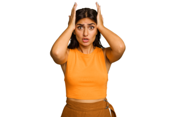 Young Indian woman isolated on green chroma background being shocked, she has remembered important meeting.