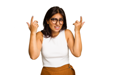Young Indian woman isolated on green chroma background showing a disappointment gesture with forefinger.