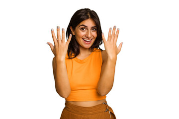 Young Indian woman isolated on green chroma background showing number ten with hands.