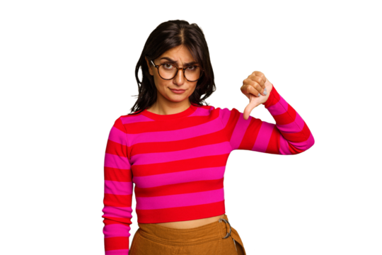 Young Indian woman isolated on green chroma background showing thumb down, disappointment concept.