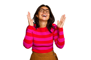 Young Indian woman isolated on green chroma background laughs out loudly keeping hand on chest.