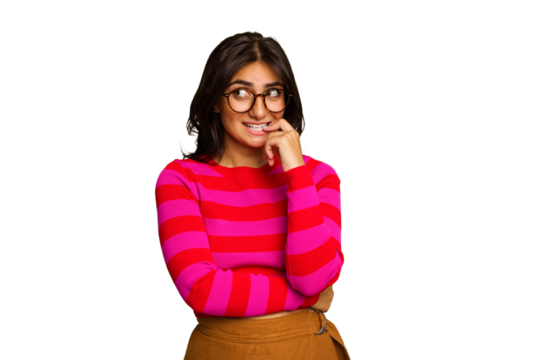 Young Indian woman isolated on green chroma background relaxed thinking about something looking at a copy space.