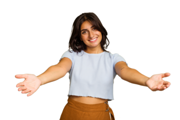Young Indian woman isolated on green chroma background showing a welcome expression.
