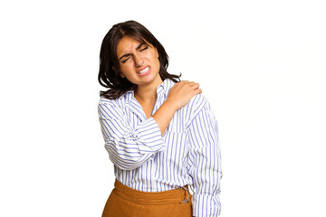 Young Indian woman isolated on green chroma background having a shoulder pain.