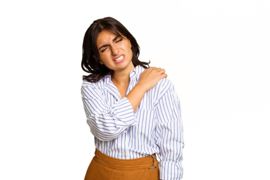 Young Indian woman isolated on green chroma background having a shoulder pain.