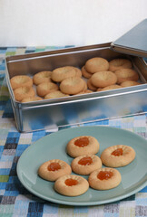 group of cookies with jam in a plate