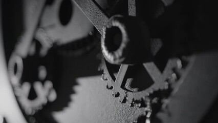 Vintage mechanism with rotating gears. Black cogwheels of machine in ancient old factory. Moving engine parts, steampunk concept. Abstract, retro mechanical technology background - Powered by Adobe