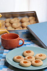 tea time with pastry cookies with jam