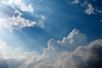 Bright sunlight in blue sky with clouds