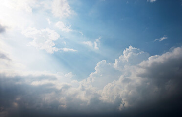 Bright sunlight in blue sky with clouds