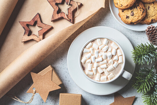 Cup of hot chocolate or cocoa with marshmallow. Festive Christmas background.