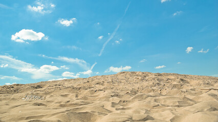 sand and blue sky, in the photo sand mountain blue sky and clouds