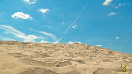 sand and blue sky, in the photo sand mountain blue sky and clouds