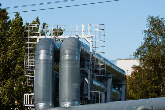 pipeline , pictured pipelines against a background of blue sky and trees