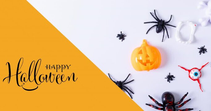 Animation of happy halloween text over spiders