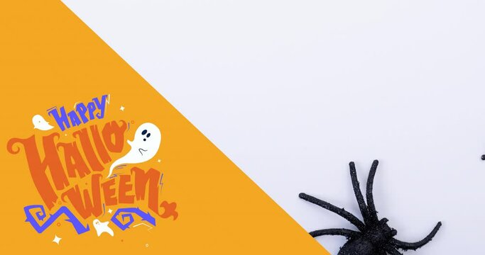 Animation of happy halloween text over spider