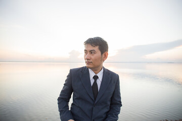 Man with her old suit at ubonrat dam,Thailand