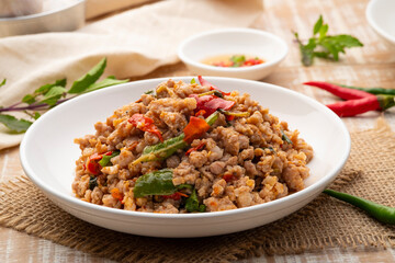 Stir Fried Minced Pork with Basil leave on white plate