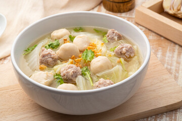 Chinese Cabbage Soup with Minced Pork and meatball in white bowl.Thai style clear soup
