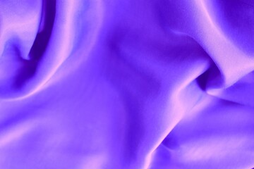 Plain light lilac fabric with beautiful pleats. Satin, linen, cotton or silk. Solid background.