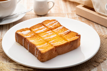 Air fryer grilled butter toast,golden brown crispy bread topped with sugar and sweetened condensed...