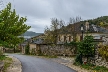 View of the stone village Ano Pedina during autumn with its architectural traditional old stone ...