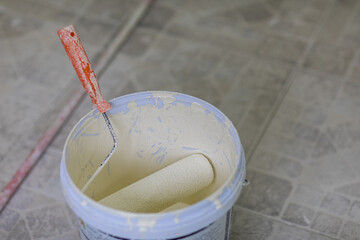 An old brushes with fresh paint on caps, painting at home, makers