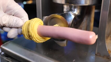 Peparation of corn dog, sausage in the dough.
