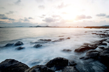 Sunset on the rocky shore.